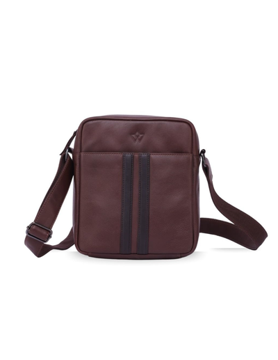 A dark brown leather crossbody bag with a front zippered pocket featuring two vertical dark stripes, a small embossed logo on the front, and an adjustable shoulder strap, shown against a plain white background.