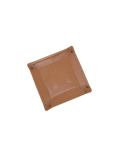 A square tan or camel-colored padded mat with rounded corners and four small dark metal grommets at the corners, shown on a plain white background.