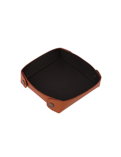 A square leather tray with a warm brown exterior and a black interior, shown from an elevated angle on a plain white background.