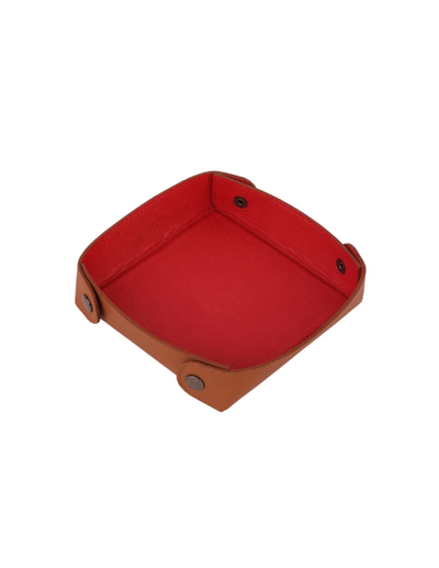 A small square red fabric tray with tan leather-like edges and snap-button closures, shown on a plain white background.