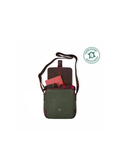 A dark green and brown crossbody bag with a red notebook peeking out from the front pocket, shown on a white background with a green 'Made in Sweden' badge in the top right.