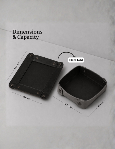 A product dimension diagram showing a square black outer shell and a folded gray interior tray, with text reading 'Dimensions & Capacity' and 'Flats fold' and measurement labels on a light gray background.